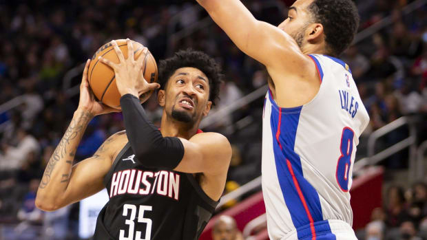 Dec 18, 2021; Detroit, Michigan, USA; Houston Rockets center Christian Wood (35) gets defended by Detroit Pistons forward Trey Lyles (8) during the second quarter at Little Caesars Arena. Mandatory Credit: Raj Mehta-USA TODAY Sports